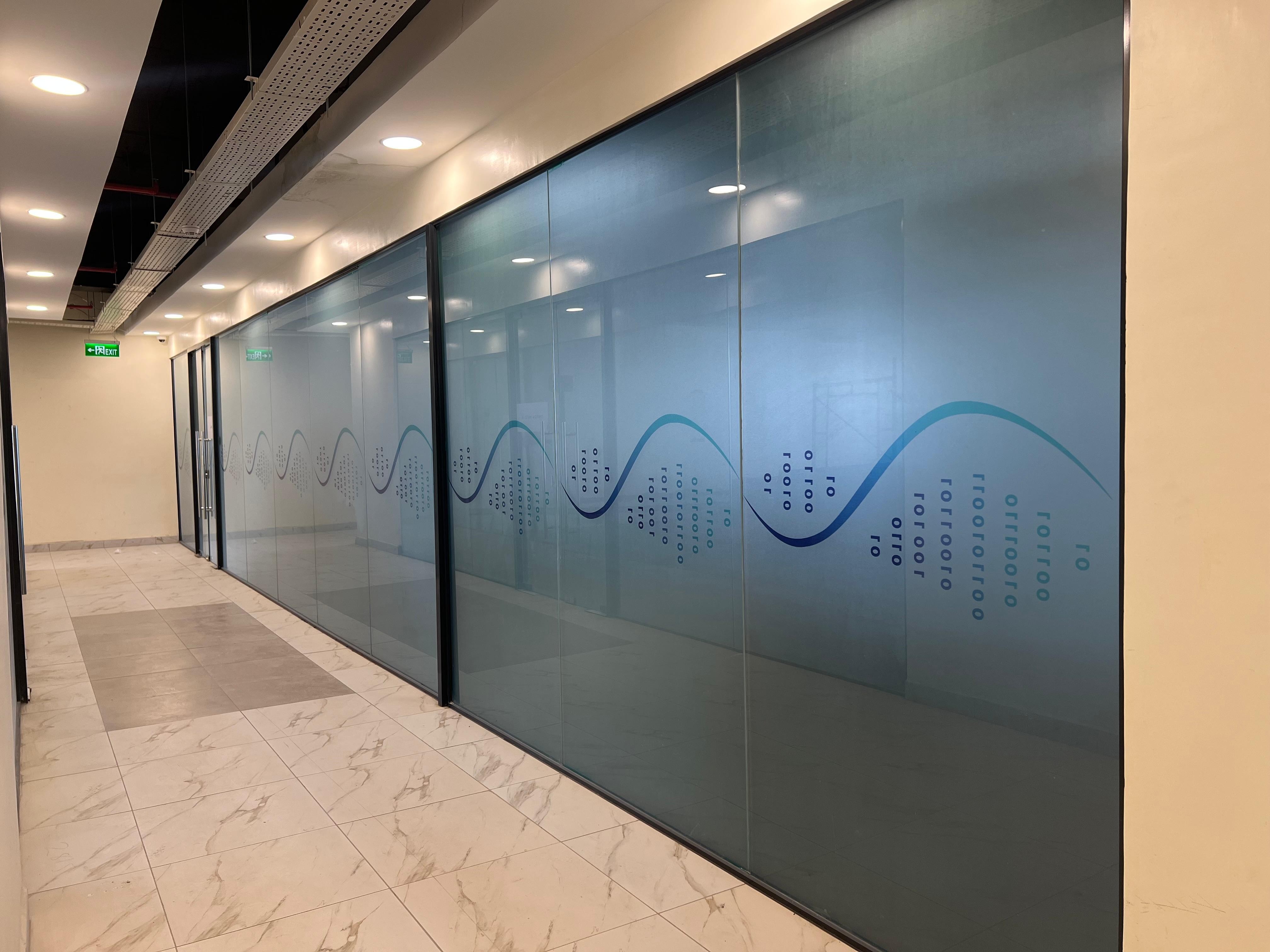Branded frosted window film installation by Fix My Space